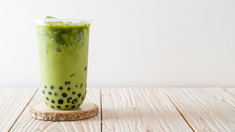 Swirling matcha bubble tea