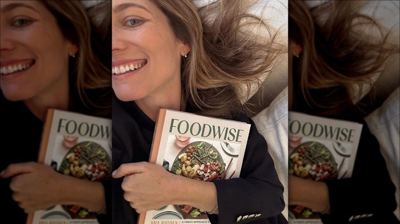 Mia Rigden hugging cookbook