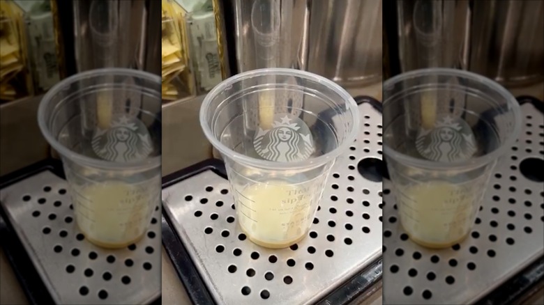 White chocolate mocha sauce at the bottom of a Starbucks cup