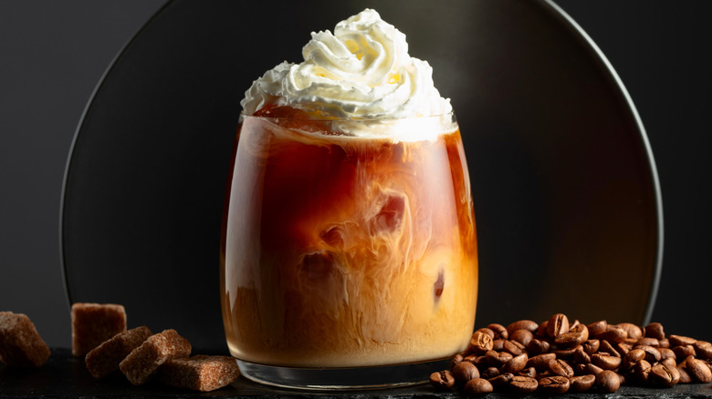 Glass of iced coffee with whipped cream