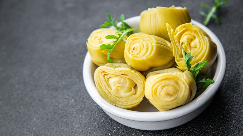 Canned artichokes in white bowl