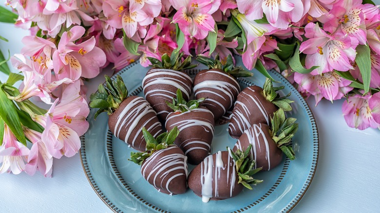 Chocolate covered strawberries and flowers