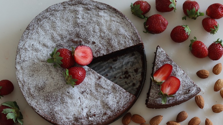 Sliced chocolate torte with toppings