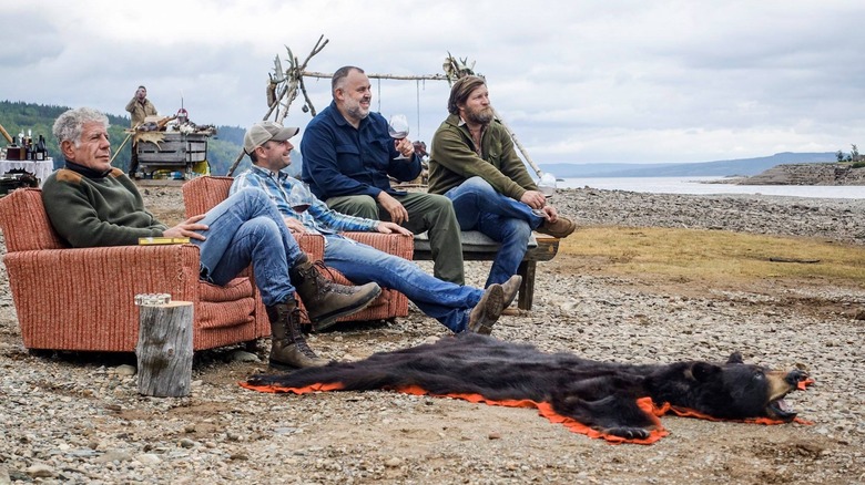 Bourdain sitting with three men