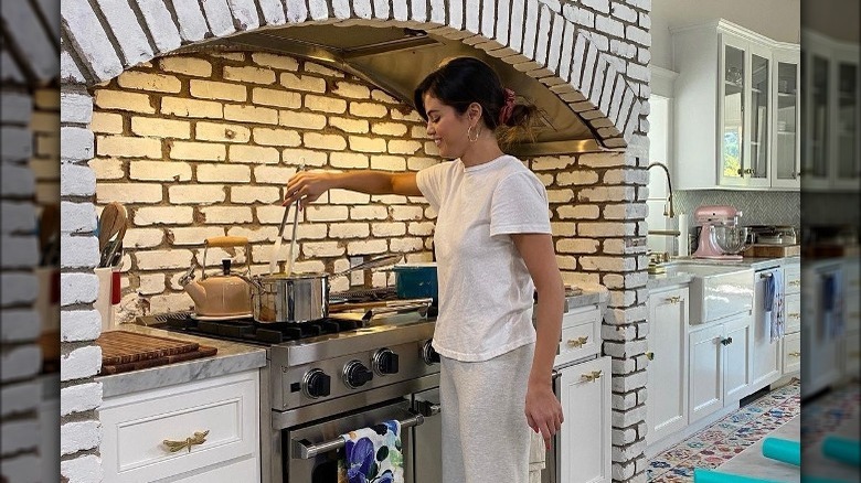 Selena cooking at her stove