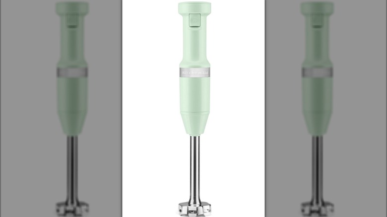 KitchenAid corded hand blender in pistachio color on white background