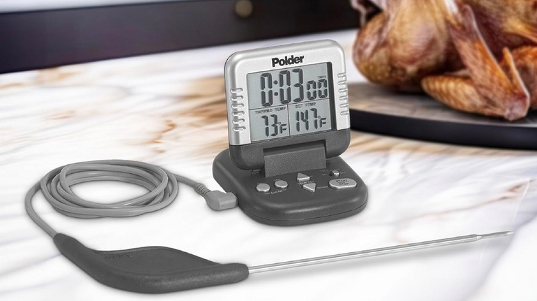 Polder meat thermometer on marble counter with roasted chicken