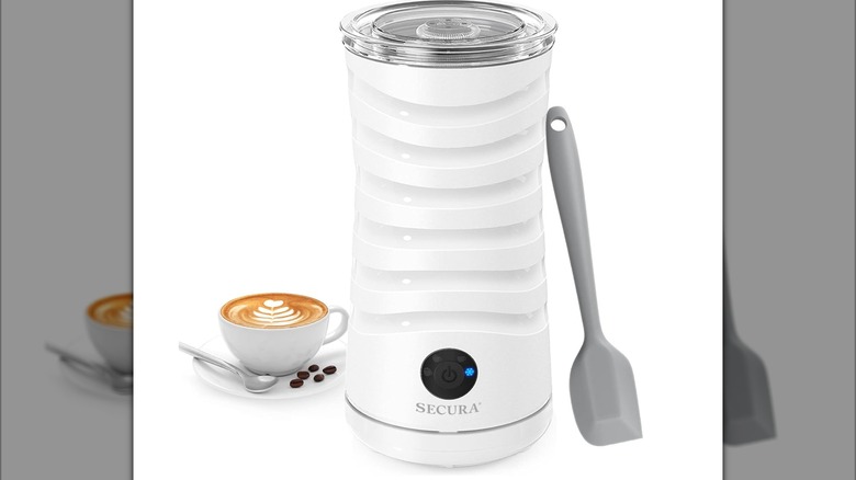 Secura Electric Milk Frother with a small latte and a spatula