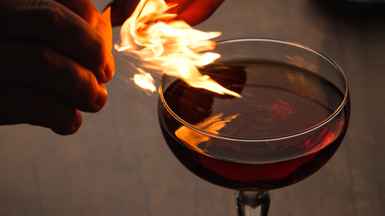 Revolver cocktail with flamed peel