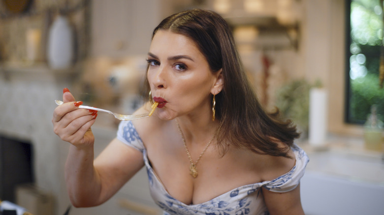 Nadia Caterina Munno eating pasta on The Pasta Queen