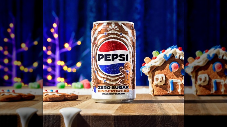 Can of Pepsi Zero Sugar Gingerbread with gingerbread house and cookie.