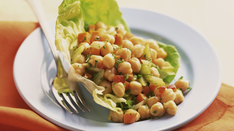 Bean salad and fork on a white plate