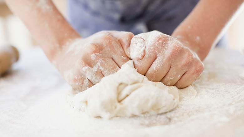 Person kneading dough