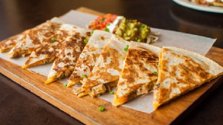 quesadilla triangles on wood board