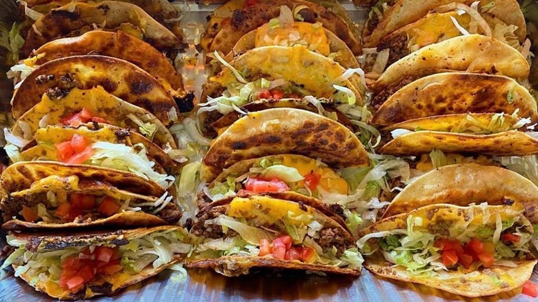 Stacks of loaded fried tacos