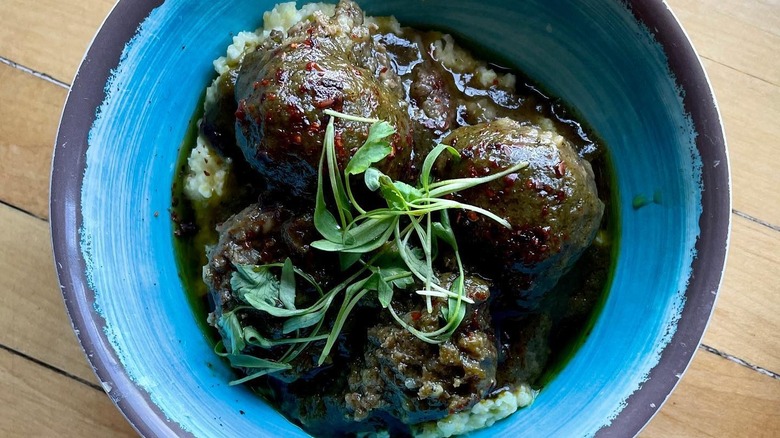 Green chile meatballs over polenta