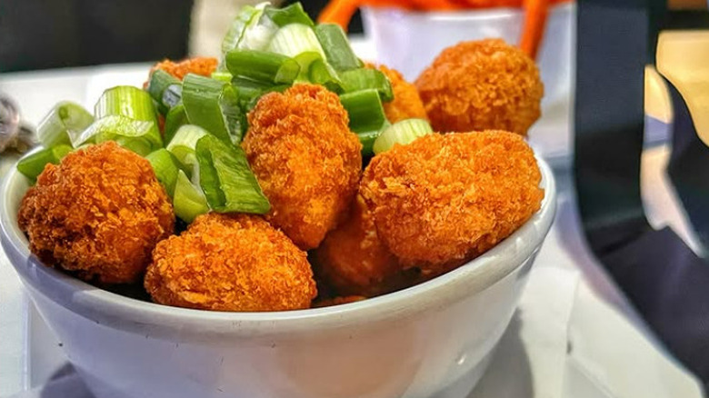 TMV's popcorn chick'n topped with green onions in bowl