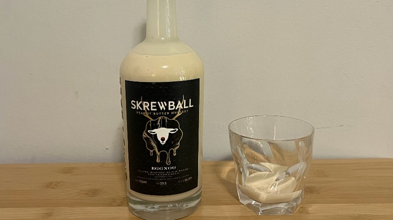 Skrewball Peanut Butter Eggnog bottle and glass