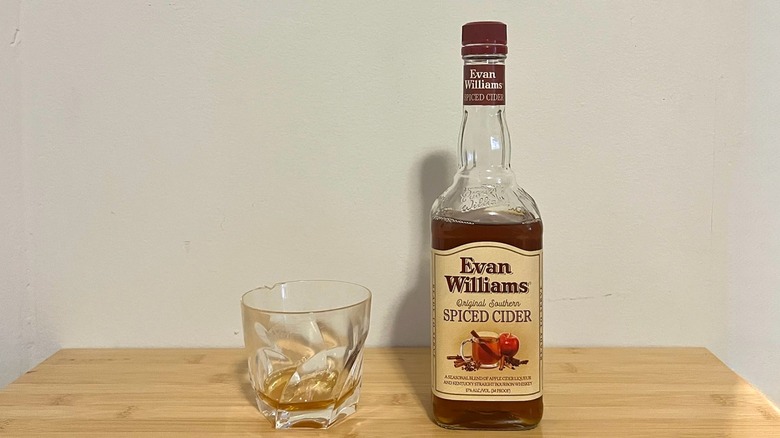 Evan Williams Spiced Cider Bourbon bottle and glass