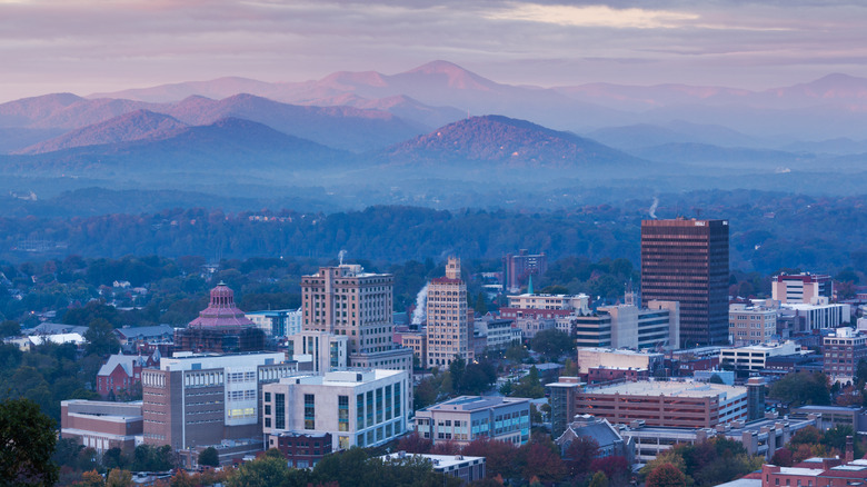 City view of Asheville at dawn with rolling hills in back