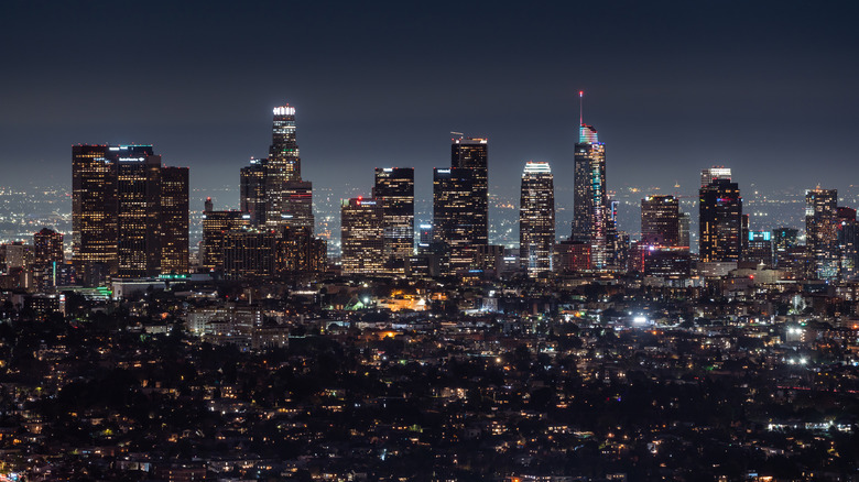 Nighttime view of downtown LA lit up from afar