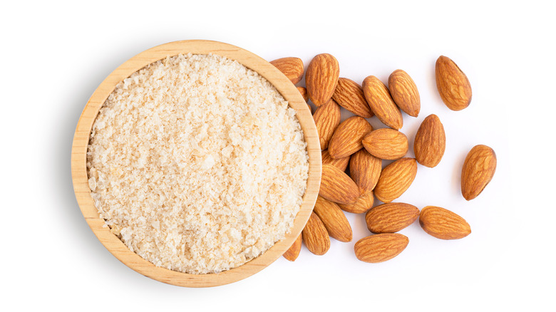 Almond flour in wooden bowl