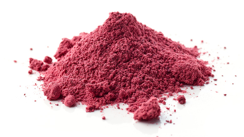 Dried beetroot powder on white background