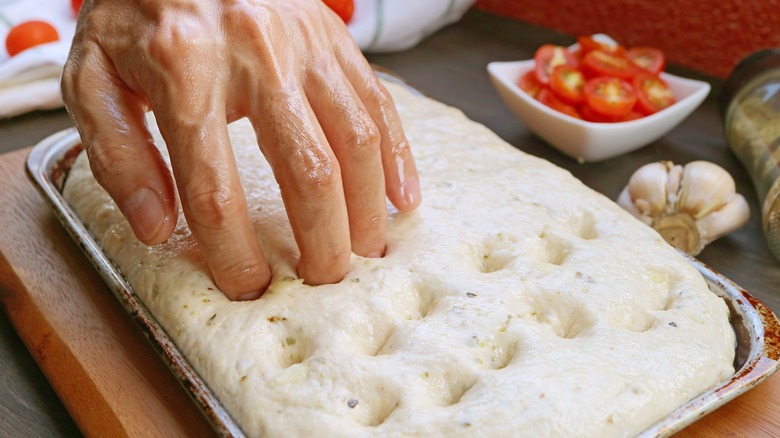 Fingertips dimpling dough