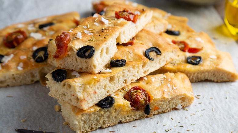 Stacked homemade focaccia with olives