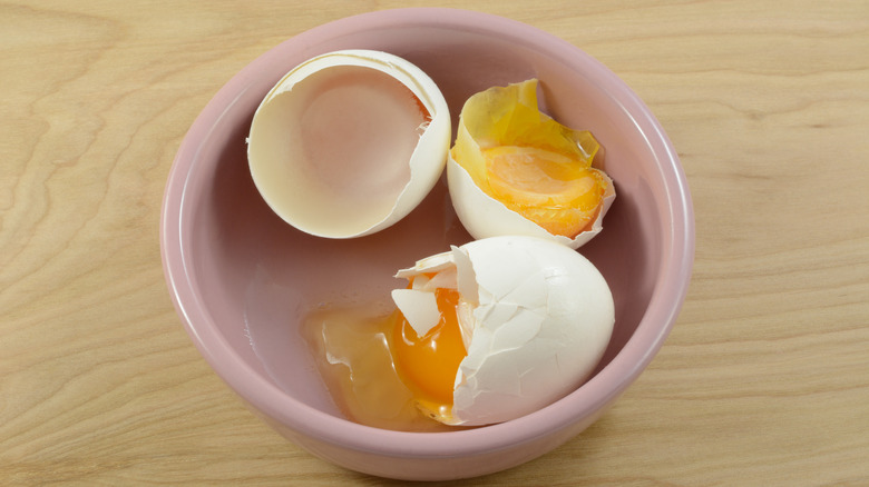 Frozen cracked egg in bowl