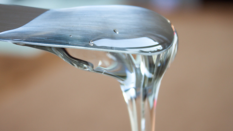 Pouring glucose syrup from spoon