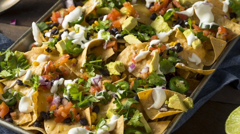 Sheet pan nachos with toppings