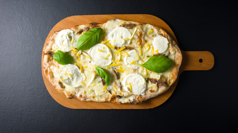 Lemon zest on white pizza