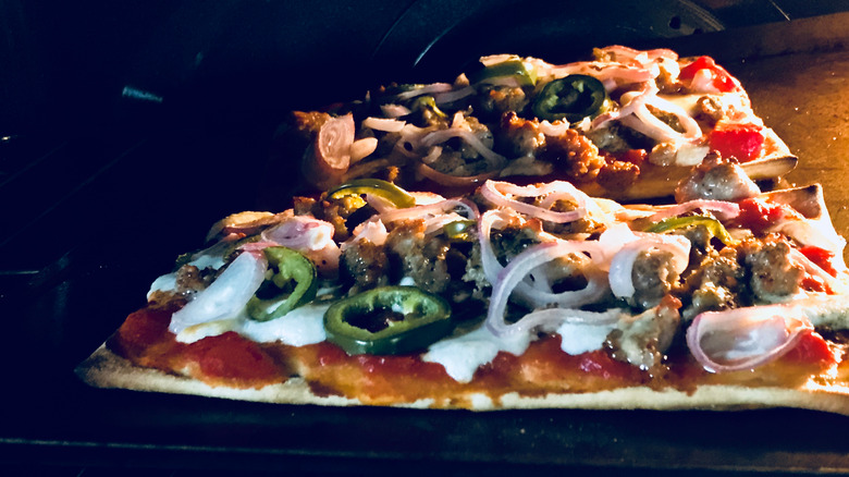 Homemade pizza baking in oven