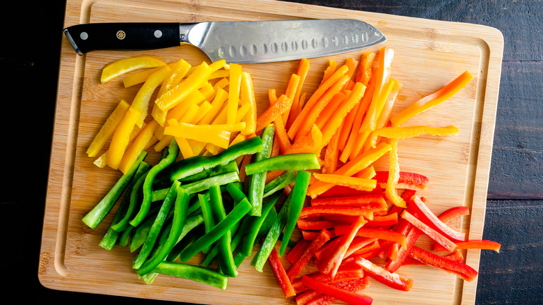 Chopped bell peppers with knife