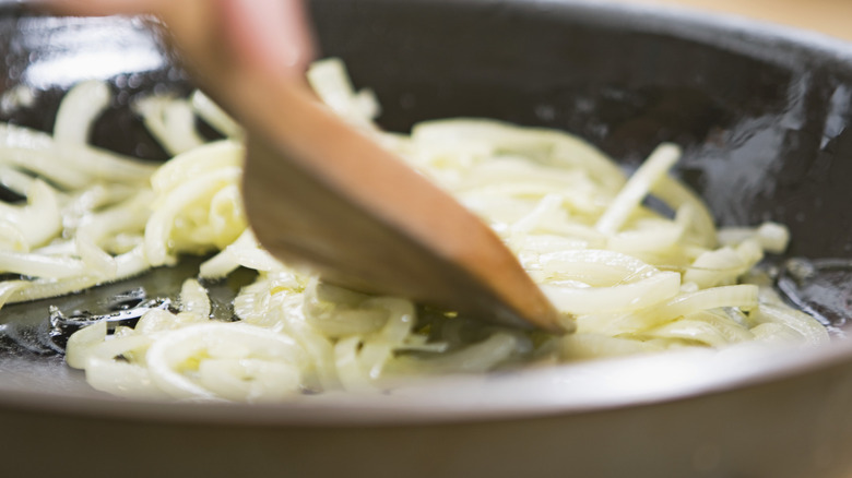 Cooking onions in a pan