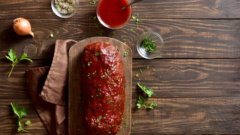 Meatloaf on cutting board with glaze