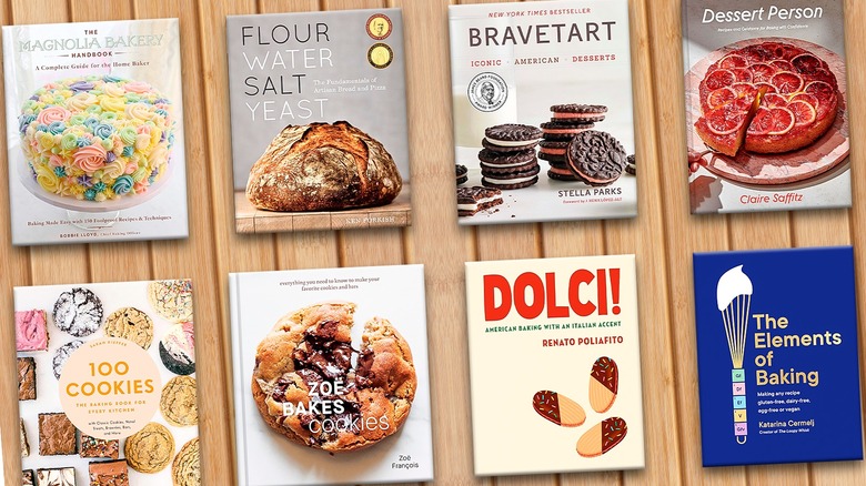 Multiple baking cookbooks on a wooden table