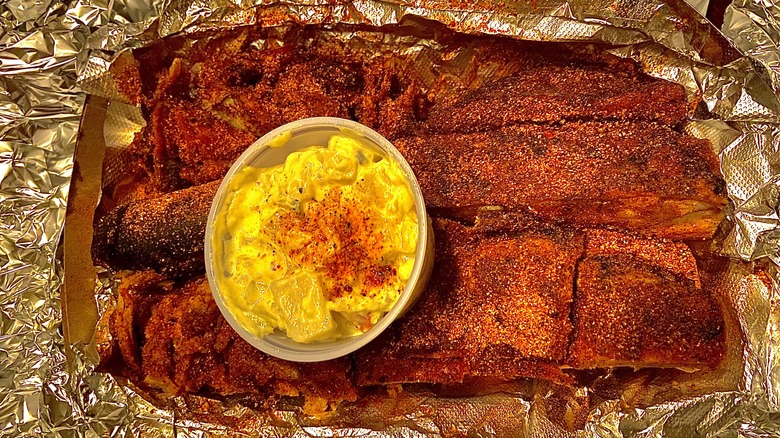 meat in foil with potato salad