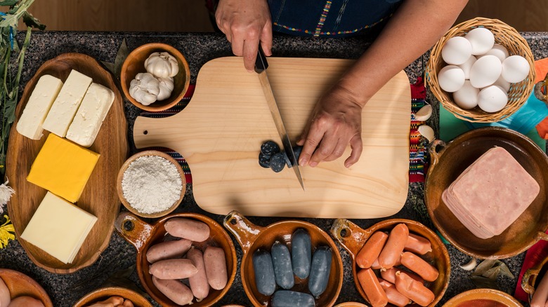 Hands chopping ingredients