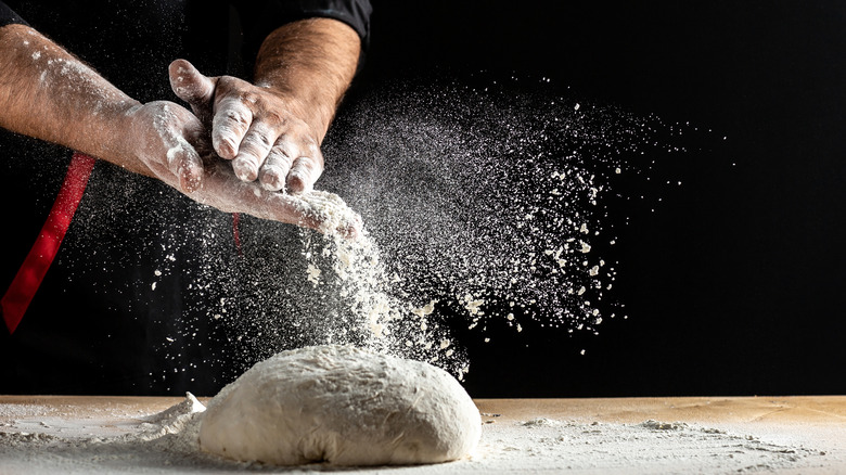 Hands making dough