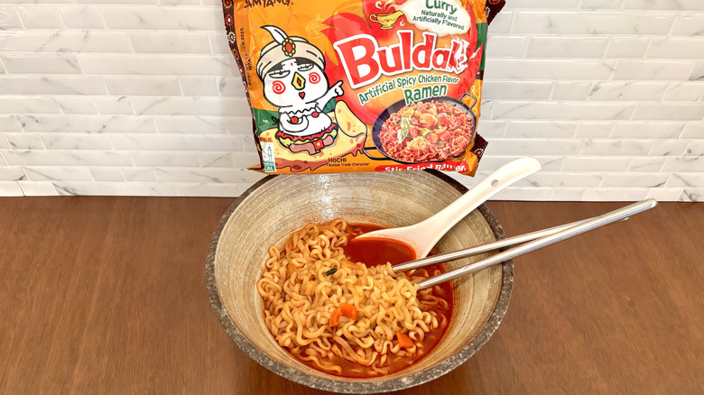 Buldak curry ramen wrapper on bowl of ramen