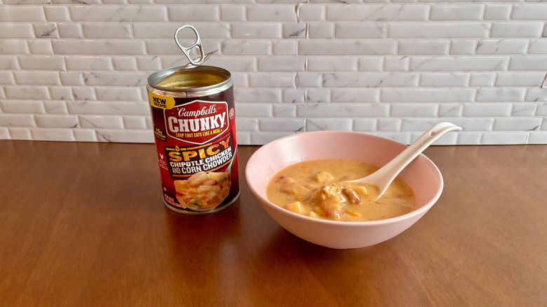 Campbell's soup can next to bowl of chowder