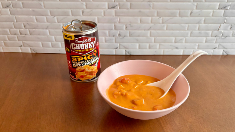 Can of Campbell's soup next to bowl of soup