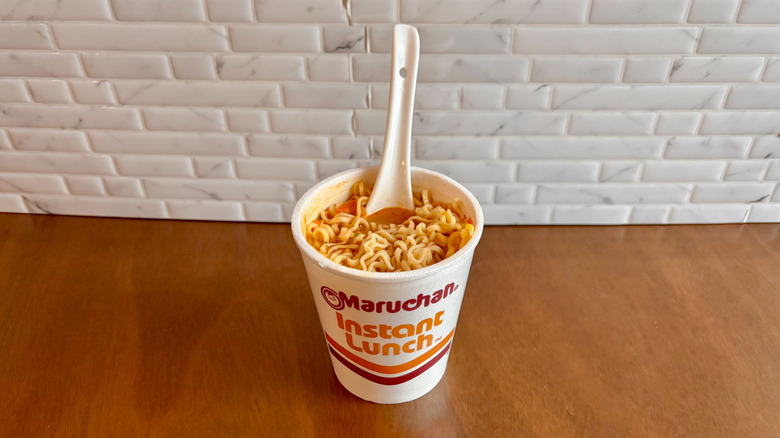 Styrofoam container of Maruchan chicken ramen with white spoon