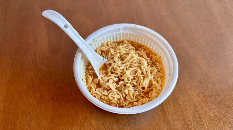 Store-bought ramen in bowl with white spoon