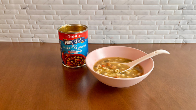 Can of Progresso soup next to bowl of soup