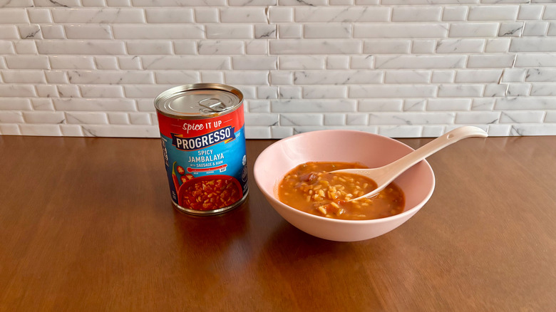 Can of Progresso soup next to bowl of jambalaya