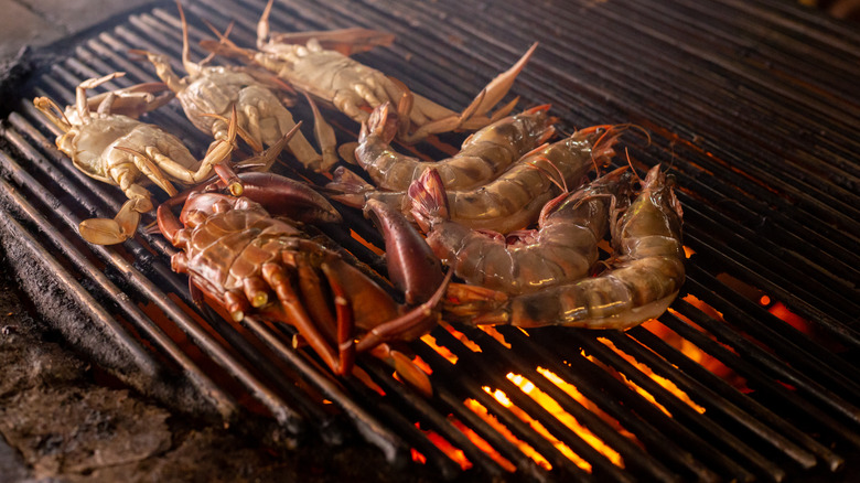 Crabs cooking on grill