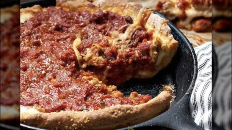 Deep dish pizza with a slice missing from Third Coast Pizza